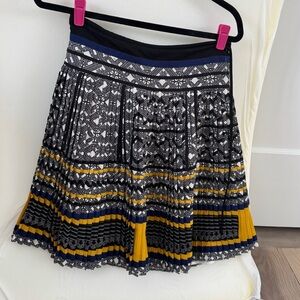 Above knee pleated skirt